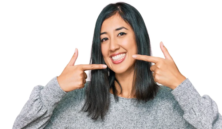 Happy patient pointing to smile